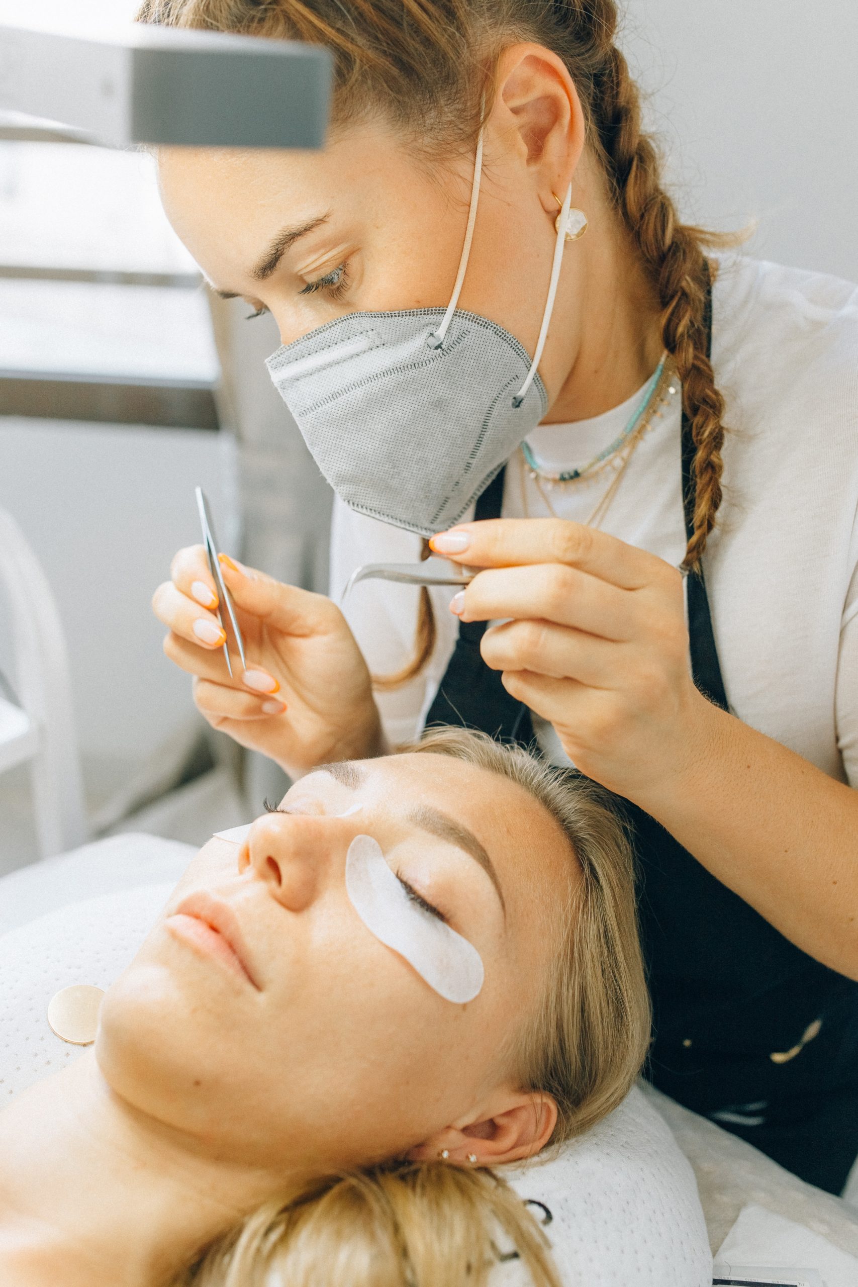 Lash artist applying lashes